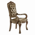 Sedia in legno con rivestimento in pelle sintetica dorata